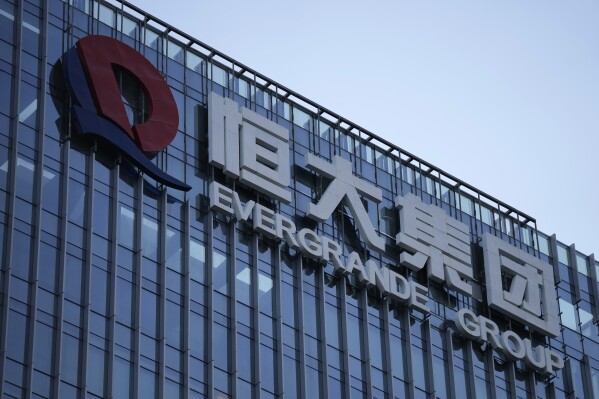FILE - The Evergrande Group headquarters logo is seen in Shenzhen in southern China's Guangdong province on Sept. 24, 2021. Shares of debt-laden property developer China Evergrande Group soared Tuesday, Oct. 3, 2023, after they resumed trading in Hong Kong following a suspension last week. (AP Photo/Ng Han Guan, File)