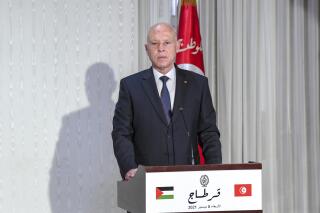 Tunisian President Kais Saied speaks during a joint press conference with his Palestinian counterpart, Mahmoud Abbas, in Carthage, near Tunis, Tunisia, Wednesday, Dec. 8, 2021. The Palestinian President is on an official visit to Tunisia. (Slim Abid/Tunisian Presidency via AP)