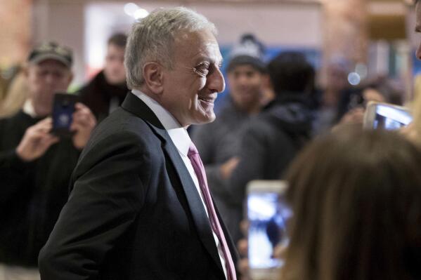 FILE - Carl Paladino speaks to members of the media at Trump Tower in New York, Dec. 5, 2016. Paladino, who is running to represent a congressional district that includes suburbs of Buffalo, New York, shared and deleted a conspiracy-laden Facebook post suggesting a racist mass shooting in Buffalo and other mass killings were part of a plot to take away people’s guns. (AP Photo/Andrew Harnik, File)