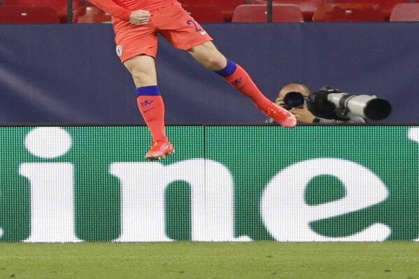Chelsea's Ben Chilwell celebrates after scoring his side's second goal during the Champions League, first leg, quarterfinal soccer match between FC Porto and Chelsea at the Ramon Sanchez-Pizjuan stadium in Seville, Spain, Wednesday, April 7, 2021. (AP Photo/Angel Fernandez)