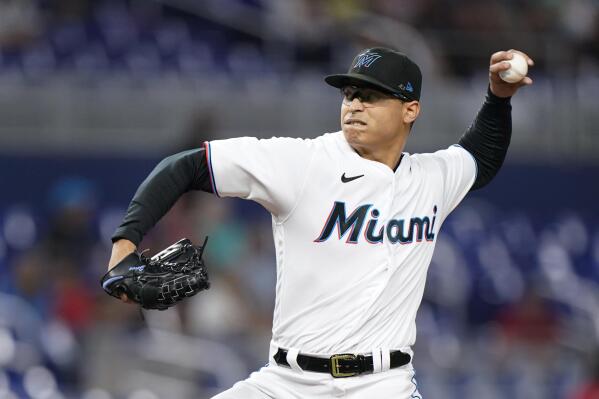 FILE - Miami Marlins' Jesus Luzardo delivers a pitch during the first inning of a baseball game against the Atlanta Braves, Oct. 3, 2022, in Miami. Luzardo went to a hearing Thursday, Feb. 2, 2023, and asked for a raise from $715,000 to $2.45 million, while Miami proposed $2.1 million. The case was heard by Stout, Melinda Gordon and Richard Bloch, who were expected to issue their decision Friday. (AP Photo/Wilfredo Lee, File)