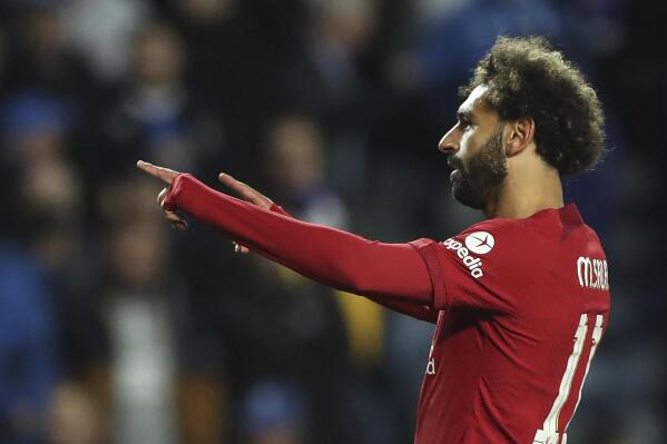 Liverpool's Mohamed Salah celebrates with teammates after scoring his side's fifth goal during the Champions League Group A soccer match between Rangers and Liverpool at Ibrox stadium in Glasgow, Scotland, Wednesday, Oct. 12, 2022. (AP Photo/Scott Heppell)