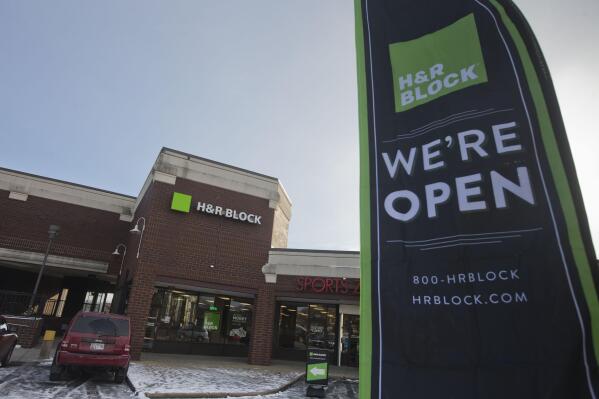 File - An ad banner appears in the parking lot of the H&R Block offices on Thursday, Jan. 8, 2015, in the Atlas District in Washington. (AP Photo/Pablo Martinez Monsivais, File)