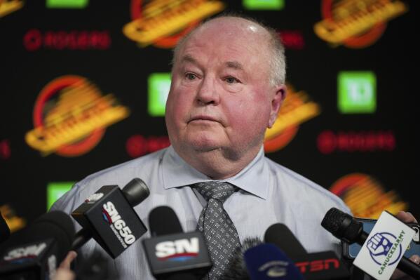 Vancouver Canucks head coach Bruce Boudreau pauses during a news conference after the team's NHL hockey game against the Edmonton Oilers on Saturday, Jan. 21, 2023, in Vancouver, British Columbia. (Darryl Dyck/The Canadian Press via AP)