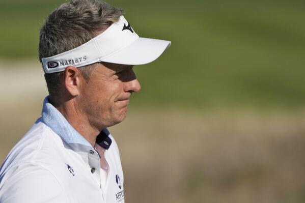 Luke Donald of England looks at the golfball during the Italian Open golf tournament in Guidonia Montecelio, near Rome, Italy, Sunday, Sept. 18, 2022. The Italian Open took place on the Marco Simone course that will host the 2023 Ryder Cup. (AP Photo/Alessandra Tarantino)