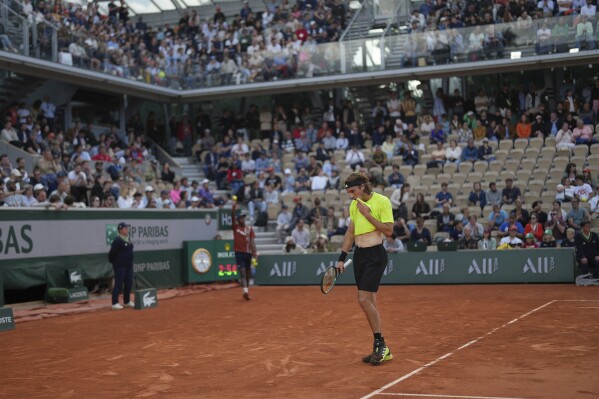 Greece's Stefanos Tsitsipas looks down as he plays Italy's Matteo Gigante during their second round match of the French Tennis Open, at the Roland-Garros stadium, in Paris, Wednesday, May 28, 2025. (AP Photo/Aurelien Morissard)