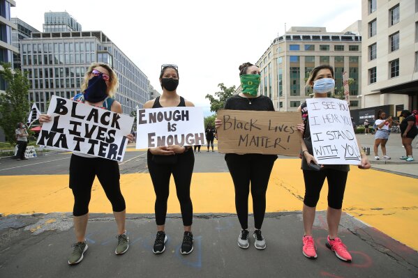 Demonstrators protest Friday, June 5, 2020, near the White House in Washington, over the death of George Floyd, a black man who was in police custody in Minneapolis. Floyd died after being restrained by Minneapolis police officers. (AP Photo/Manuel Balce Ceneta)