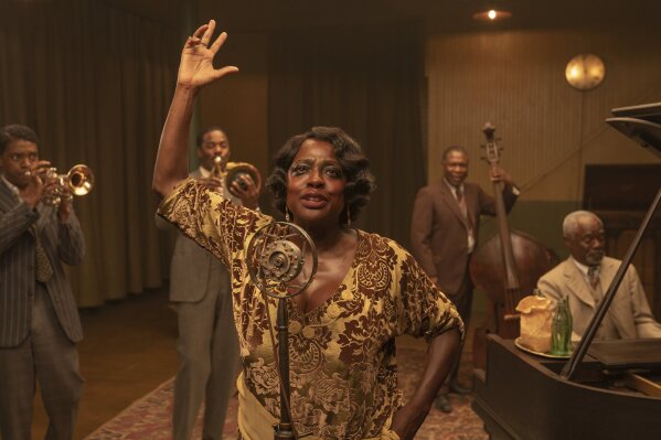 This image released by Netflix shows Chadwick Boseman, from left, Colman Domingo, Viola Davis, Michael Potts and Glynn Turman in "Ma Rainey's Black Bottom."  (David Lee/Netflix via AP)