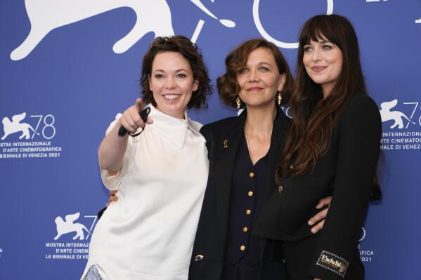 Olivia Colman, from left, Maggie Gyllenhaal and Dakota Johnson pose for photographers at the photo call for the film 'The Lost Daughter' during the 78th edition of the Venice Film Festival in Venice, Italy, Friday, Sep, 3, 2021. (AP Photo/Domenico Stinellis)