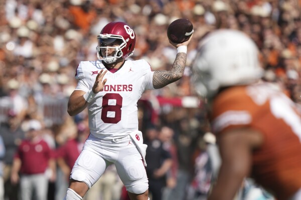 Oklahoma quarterback Dillon Gabriel (8) throws a pass during the first half of an NCAA college football game against Texas at the Cotton Bowl in Dallas, Saturday, Oct. 7, 2023. (AP Photo/LM Otero)