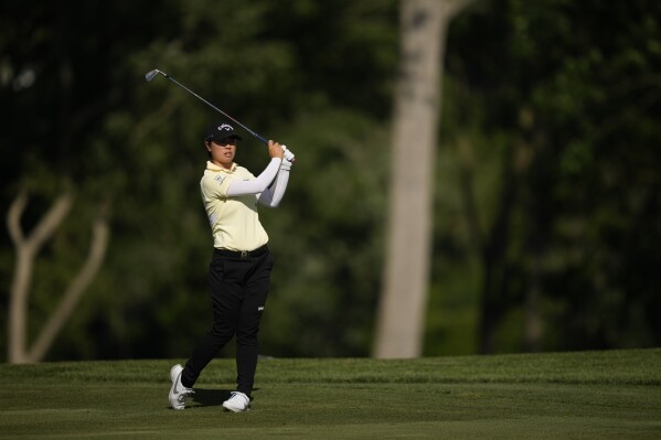 Yuka Saso, of Japan, hits from the fairway on the ninth hole during the first round of the U.S. Women's Open golf tournament at Lancaster Country Club, Thursday, May 30, 2024, in Lancaster, Pa. (AP Photo/Matt Slocum)