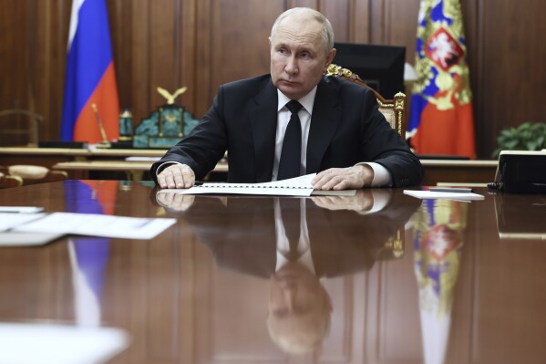 FILE - Russian President Vladimir Putin listens to Russian Deputy Prime Minister - Minister of Industry and Trade Denis Manturov during a meeting at the Kremlin, in Moscow, Russia, Tuesday, Oct. 24, 2023. Putin declared earlier this month that Moscow could play the role of mediator to help end the Israel-Hamas war, thanks to its friendly ties with both Israel and the Palestinians, adding that 