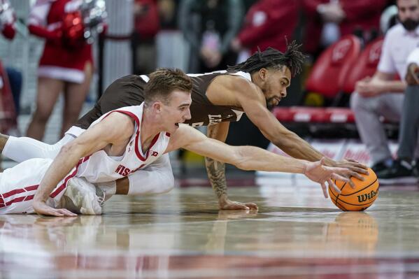 Wisconsin's Tyler Wahl (5) and Lehigh's Jalin Sinclair (55) dive after a loose ball during the first half of an NCAA college basketball game Thursday, Dec. 15, 2022, in Madison, Wis. (AP Photo/Andy Manis)