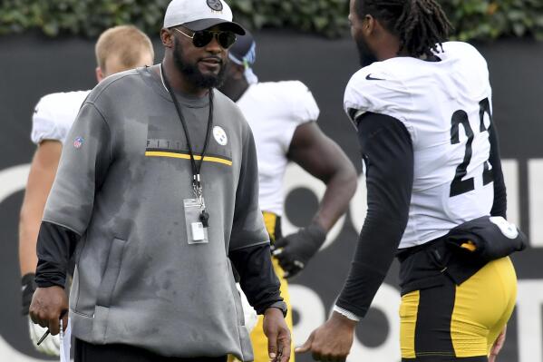 Pittsburgh Steelers coach Mike Tomlin talks with running back Najee Harris during NFL football practice Wednesday, Oct. 13, 2021, in Pittsburgh. (Matt Freed/Pittsburgh Post-Gazette via AP)