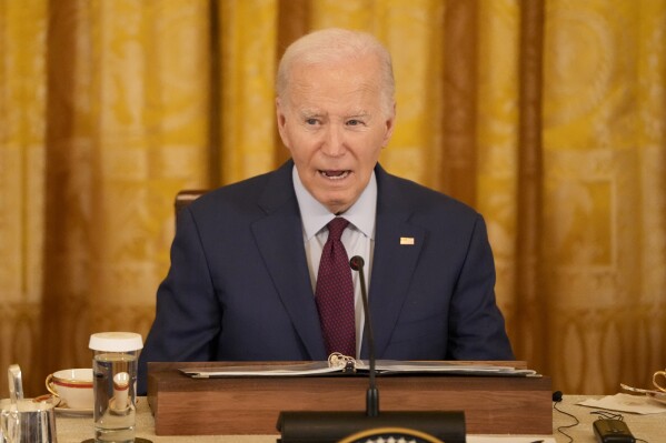 President Joe Biden speaks during a trilateral meeting with Philippine President Ferdinand Marcos Jr. and Japanese Prime Minister Fumio Kishida in the East Room of the White House in Washington, Thursday, April 11, 2024. (AP Photo/Mark Schiefelbein)