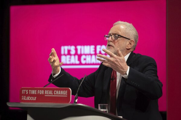 Britain's main opposition Labour Party leader Jeremy Corbyn speaks at the launch of the Labour Party race and faith manifesto, in London, Tuesday Nov. 26, 2019.  The race and faith manifesto comes after the Labour Party and its leader Jeremy Corbyn have been deeply tarnished by anti-Semitism accusations, as the UK prepares to go to the polls in a General Election on Dec. 12. (Joe Giddens/PA via AP)