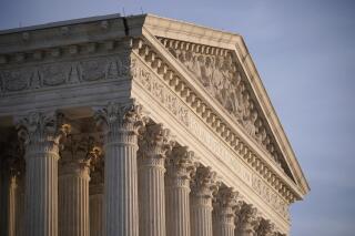 FILE - In this Nov. 5, 2020, file photo the Supreme Court is seen in Washington. With abortion and guns already on the agenda, the conservative-dominated Supreme Court is considering adding a third blockbuster issue _ whether to ban consideration of race in college admissions.  (AP Photo/J. Scott Applewhite, File)