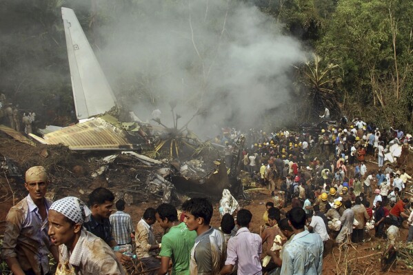 FILE- Rescuers work at the site of an Air India plane that crashed in Mangalore, in the southern Indian state of Karnataka, Saturday, May 22, 2010. (AP Photo)