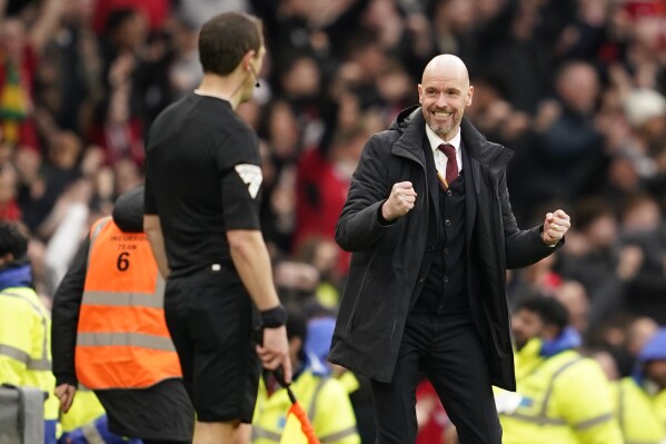Manchester United's head coach Erik ten Hag celebrates after Manchester United's Antony scored his side's second goal during the FA Cup quarterfinal soccer match between Manchester United and Liverpool at the Old Trafford stadium in Manchester, England, Sunday, March 17, 2024. (AP Photo/Dave Thompson)