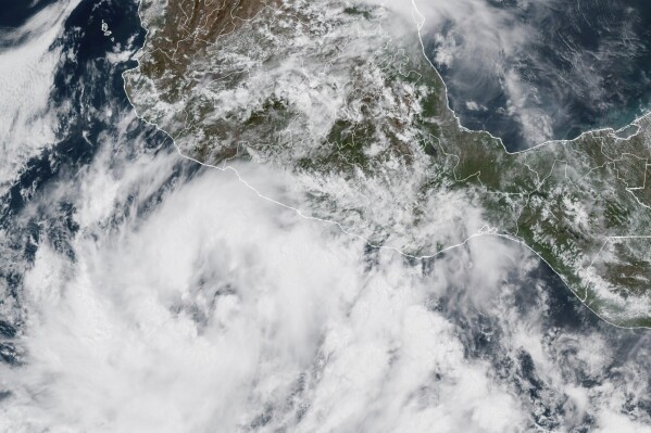 This GOES-19 GoeColor satellite image taken Friday, June 13, 2025, at 1:40 p.m .EDT, and provided by NOAA shows Tropical Storm Dalila in the eastern Pacific Ocean just south of the southwestern coast of Mexico. (NOAA via AP)