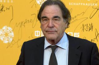 FILE - This April 16, 2014 file photo shows director Oliver Stone at the 4th Beijing International Film Festival held in Beijing, China. On Saturday, May 7, 2016, Stone told University of Connecticut graduates of his academic failures that led him to drop out of school for a while before starting fresh at a new university and ultimately launching a successful film career, during a graduate school commencement address at UConn's main campus in Storrs, Conn. (AP Photo/Ng Han Guan, File)