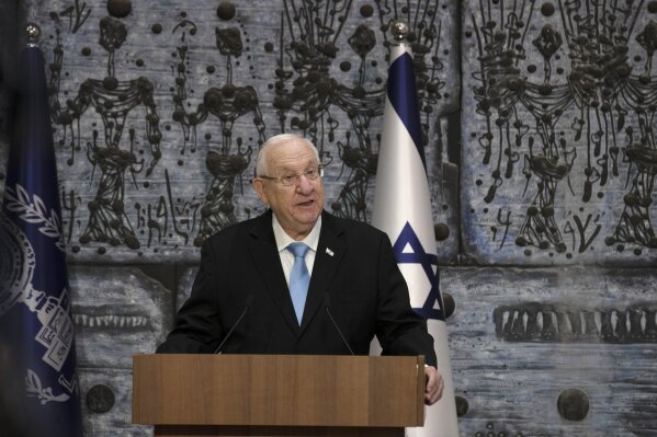 Israeli President Reuvin Rivlin makes remarks after receiving official election results from Chairman of Israel's Central Elections Committee Judge Uzi Fogelman in Jerusalem, Wednesday, March 31, 2021. Israeli election officials Wednesday handed the results of last week's vote to President Rivlin, nudging forward the country' elusive efforts to break political deadlock, form a government and avoid an unprecedented fifth consecutive round of balloting.  (AP Photo/Maya Alleruzzo)