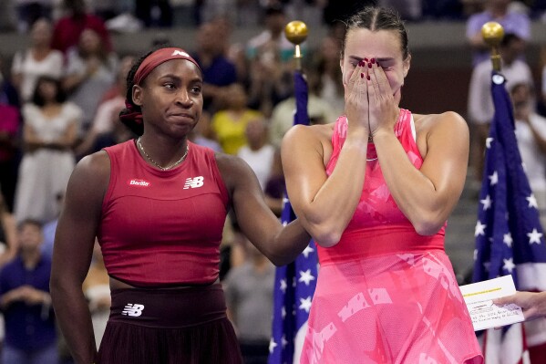 Aryna Sabalenka, of Belarus, right reacts after losing to Coco Gauff, of the United States, left, in the women's singles final of the U.S. Open tennis championships, Saturday, Sept. 9, 2023, in New York. (AP Photo/Frank Franklin II)