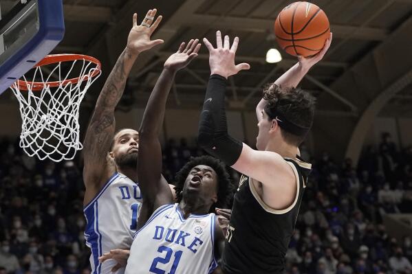 Duke forward Theo John forward AJ Griffin (21) defend against Wake Forest forward Jake LaRavia (0) during the first half of an NCAA college basketball game in Durham, N.C., Tuesday, Feb. 15, 2022. (AP Photo/Gerry Broome)