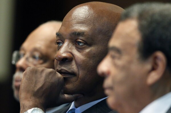 FILE - Harvard law professor Charles Ogletree Jr., center, takes part in a panel discussion during the National Association of Black Journalists convention in Boston on Aug. 1, 2014. Ogletree, a law professor and civil rights scholar with a distinguished career at Harvard Law School and whose list of clients ranged from Anita Hill to Tupac Shakur, died Friday, Aug. 4, 2023, after a lengthy battle with Alzheimer's disease. He was 70. (AP Photo/Michael Dwyer, File)