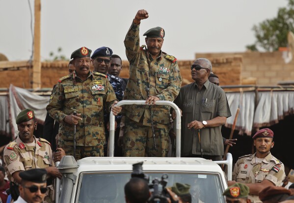 Sudanese Gen. Abdel-Fattah Burhan, head of the military council, waves to supporters upon his arrival to attend a military-backed rally, in Omdurman district, west of Khartoum, Sudan, on June 29, 2019. (AP Photo/Hussein Malla, File)