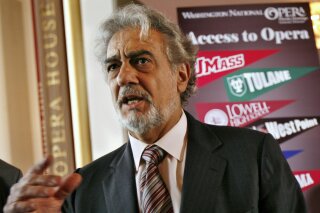 FILE - In this May 23, 2007, file photo, Placido Domingo, general director of the Washington National Opera, speaks during a news conference in Washington about a simulcast of a performance of La Boheme. An investigation into Domingo by the U.S. union representing opera performers found more than two dozen people who said they were sexually harassed or witnessed inappropriate behavior by the superstar when he held senior management positions at Washington National Opera and Los Angeles Opera, according to people familiar with the findings. (AP Photo/Jacquelyn Martin, File)