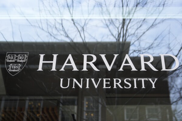 The Harvard University logo is displayed on a building at the school, Tuesday, April 15, 2025, in Cambridge, Mass. (AP Photo/Charles Krupa, File)