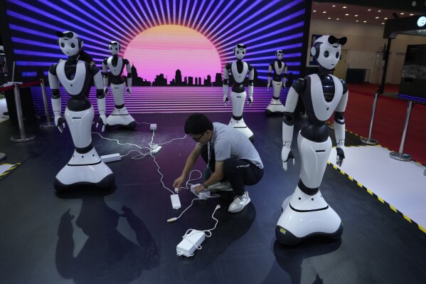 Lifelike robots and android dogs wow visitors at Beijing robotics fair | AP  News