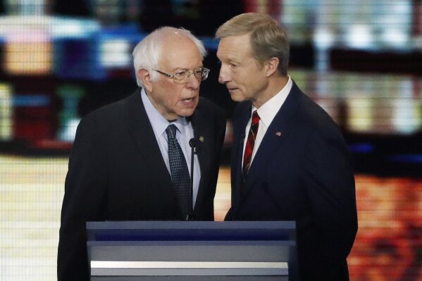 FILE - In this Feb. 7, 2020, file photo, Democratic presidential candidates Sen. Bernie Sanders, I-Vt., left, and businessman Tom Steyer speak together during a break in a Democratic presidential primary debate in Manchester, N.H. With more visible support among black voters than seen in his 2016 South Carolina campaign, coupled with momentum from earlier contests, fierce competition for the crucial support of black voters and a wildcard GOP effort, Sanders could be poised either for an upset victory or a close second-place finish, a damaging blow to the “firewall” of support needed by Joe Biden in the state. If either scenario were to become reality following the Feb. 29 vote, Sanders may have Steyer to thank for eating into the former vice president’s support among black voters. (AP Photo/Elise Amendola, File)