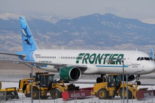 FILE 0 A Frontier Airlines jetliner arrives at Denver International Airport, Tuesday, Jan. 16, 2024, in Denver. Frontier Airlines, which has struggled more than other U.S. carriers to recover from the pandemic, says it is eliminating change fees on some tickets and creating four fare classes to boost its appeal to more travelers. (AP Photo/David Zalubowski, File)