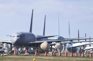 FILE - In this April 7, 2020, file photo, U.S. Air Force KC-46 tankers being built by Boeing sit parked at the Paine Field airport in Everett, Wash. Boeing failed to sell a single commercial airplane but saw orders for 108 planes canceled in April as a sharp drop in air travel erased any demand among airlines for new jetliners. It marked the second month this year in which Boeing received no orders, a fate that would have seemed impossible not long ago. (AP Photo/Ted S. Warren, File)