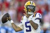 FILE - LSU quarterback Jayden Daniels throws the ball during the first half of an NCAA football game against Mississippi on Saturday, Sept. 30, 2023, in Oxford, Miss. Daniels was selected as The Associated Press college football player of the year, Thursday, Dec. 7, 2023, the school's second winner in the past five seasons. (AP Photo/Vasha Hunt, File)
