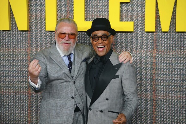 Actors Ray Winstone and Giancarlo Esposito pose for photos at the premiere of the Netflix series "The Gentlemen", at the Theatre Royal Drury Lane, in London, Tuesday March 5, 2024. (Victoria Jones/PA via AP)