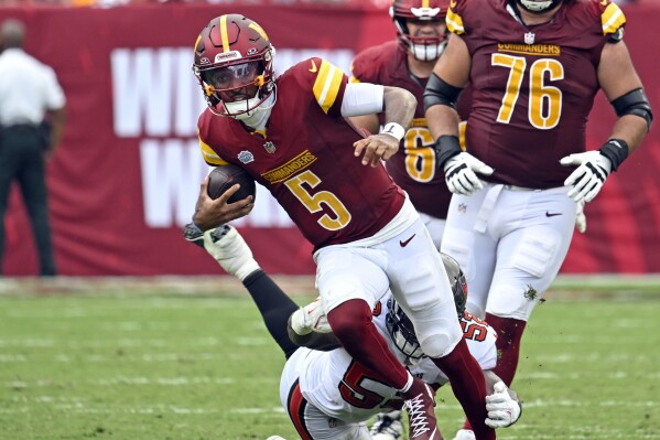 Commanders want Jayden Daniels to 'remain a passer' after running 16 times  in his NFL debut | AP News