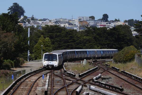 A Bay Area Rapid Transit train approaches a BART station in Daly City, Calif., Friday, May 9, 2025. (AP Photo/Jeff Chiu)