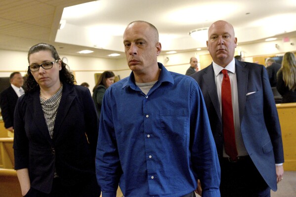 David Meehan, center, walks out of the courtroom with his attorney Rus Rilee and victim specialist Joelle Wiggin during Meehan's trial at Rockingham Superior Court in Brentwood, N.H., on Wednesday, April 10, 2024. (David Lane/Union Leader via AP, Pool)