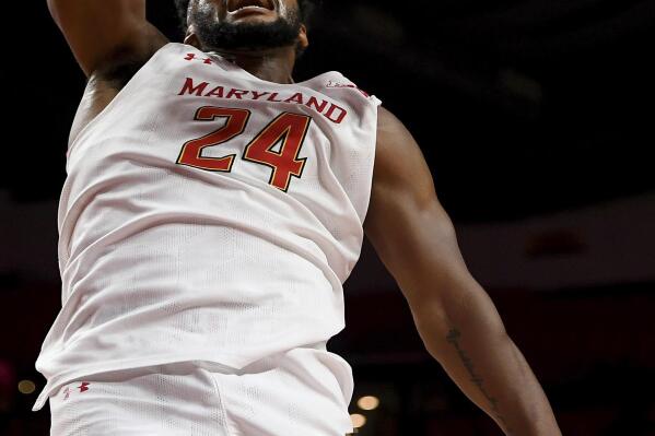 Maryland forward Donta Scott (24) dunks the ball during the second half of an NCAA college basketball game against Niagara, Monday, Nov. 7, 2022 in College Park, Md. (Katherine Frey/The Washington Post via AP)