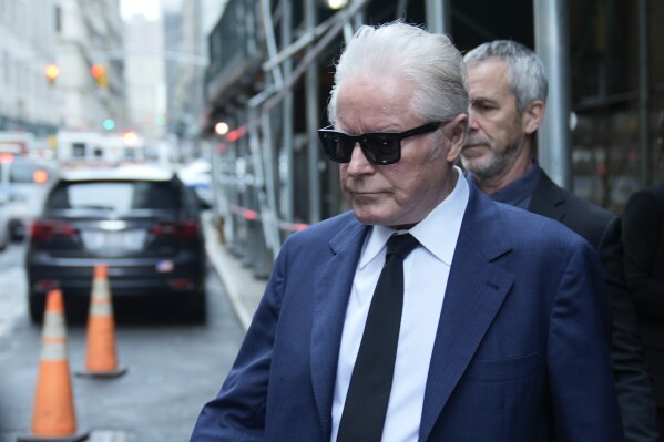 Musician Don Henley leaves the courthouse in New York, Wednesday, Feb. 28, 2024. The Eagles co-founder testified this week in the criminal trial of three collectibles dealers charged with conspiring to own and attempt to sell handwritten draft lyrics to “Hotel California” and other Eagles hits without the right to do so. The men have pleaded not guilty. (AP Photo/Seth Wenig)