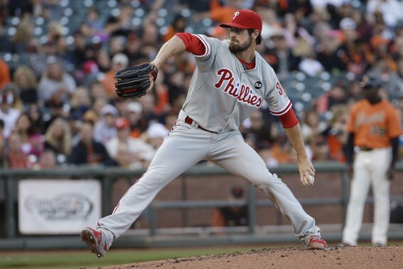 FILE - Philadelphia Phillies pitcher Cole Hamels throws to a San Francisco Giants batter during the first inning of a baseball game in San Francisco, July 10, 2015. Former World Series MVP and four-time All-Star Hamels has retired after his attempt at a comeback with his hometown San Diego Padres fell short. The Padres signed Hamels to a minor league contract in February. They announced his retirement, which agent John Boggs confirmed. (AP Photo/Jeff Chiu, File)