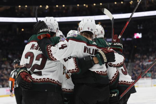 Arizona Coyotes players celebrate their goal against the Columbus Blue Jackets during the third period of an NHL hockey game Tuesday, Oct. 25, 2022, in Columbus, Ohio. (AP Photo/Jay LaPrete)