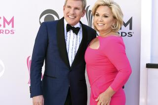 FILE - Todd Chrisley, left, and his wife, Julie Chrisley, pose for photos at the 52nd annual Academy of Country Music Awards on April 2, 2017, in Las Vegas. The couple, stars of the reality television show “Chrisley Knows Best,” have been found guilty in Atlanta on federal charges including bank fraud and tax evasion Tuesday, June 7, 2022. (Photo by Jordan Strauss/Invision/AP, File)