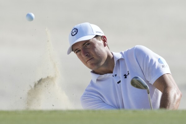 Jordan Spieth, of the United States, watches his hit from the sand on the third hole during the third round of the Hero World Challenge PGA Tour at the Albany Golf Club, in New Providence, Bahamas, Saturday, Dec. 2, 2023. (AP Photo/Fernando Llano)
