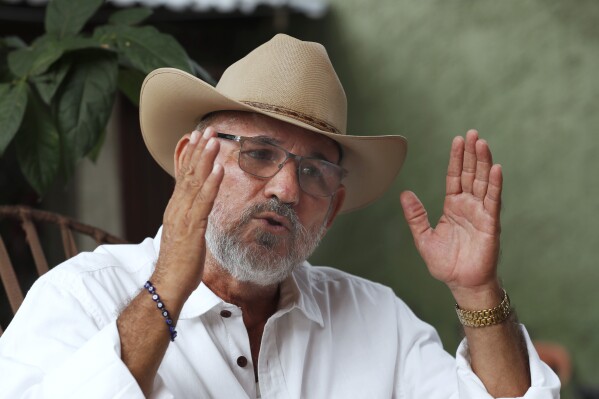 FILE - Hipolito Mora, founder of the state's civilian armed self-defense movement, speaks during an interview at his home in Ruana, Michoacan state, Mexico, Oct. 3, 2019. Mora was killed on Thursday, June 29, 2023, after he had complained in recent years that many vigilante forces had been infiltrated by cartels and gang violence was worse than ever.(AP Photo/Marco Ugarte, File)