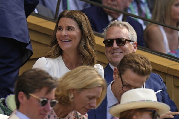 FILE - Melinda French Gates, center, sits in the Royal Box on Centre Court to watch Serbia's Novak Djokovic and Britain's Cameron Norrie in a men's singles semifinal on day twelve of the Wimbledon tennis championships in London, Friday, July 8, 2022. The charitable wing of the women's professional tennis tour and the Bill and Melinda Gates Foundation have started a joint effort to provide prenatal vitamins to 1 million women in low- and middle-income countries. The Women Change the Game campaign was announced Friday, March 7, 2024.(AP Photo/Alastair Grant, File)