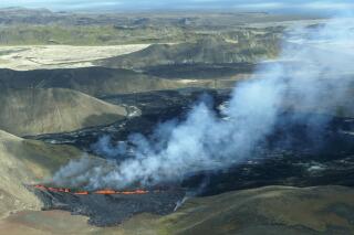 A aerial shot of activity from the Fagradalsfjall volcano in Iceland on Wednesday Aug. 3, 2022, which is located 32 kilometers (20 miles) southwest of the capital of Reykjavik and close to the international Keflavik Airport. Authorities in Iceland say a volcano in the southwest of the country is erupting just eight months after its last eruption officially ended. (AP Photo/Ernir Snær)